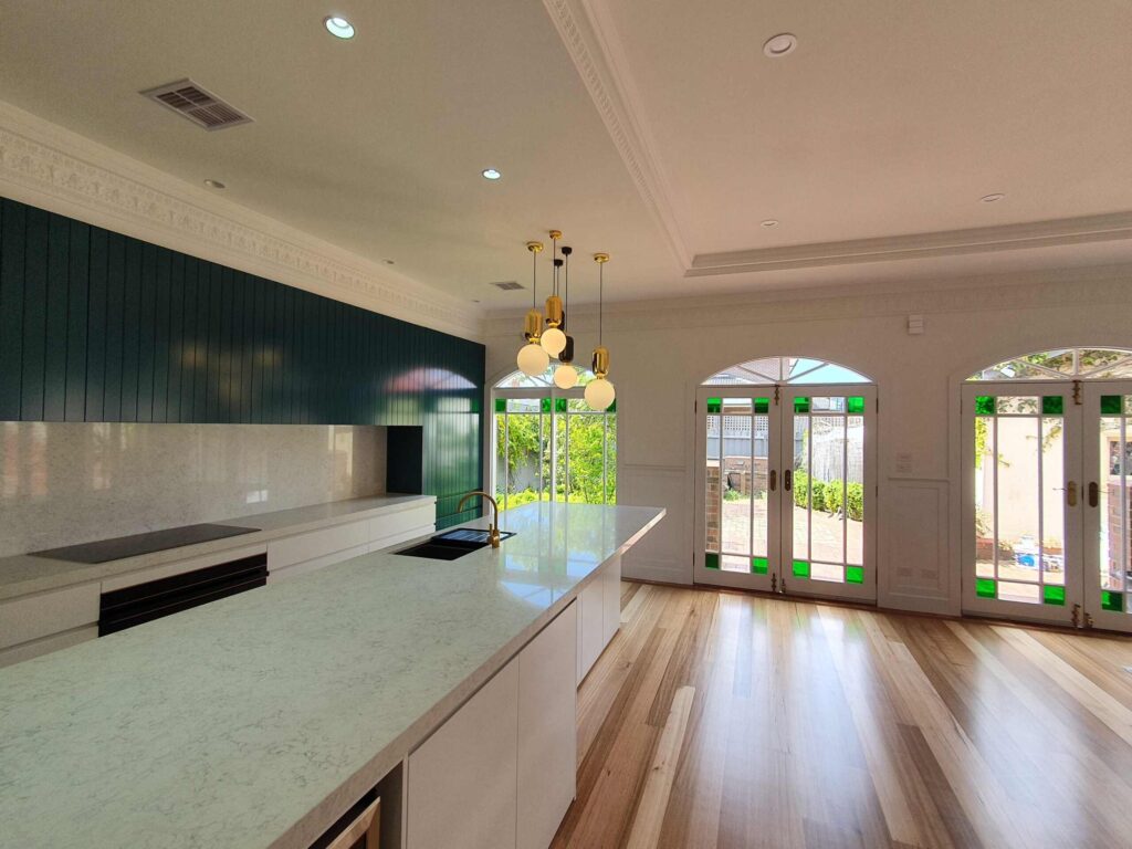 Period-style kitchen with modern electrical fittings by Electra Electrics, showcasing a blend of classic and contemporary design elements to enhance both the functionality and aesthetic of the kitchen space.