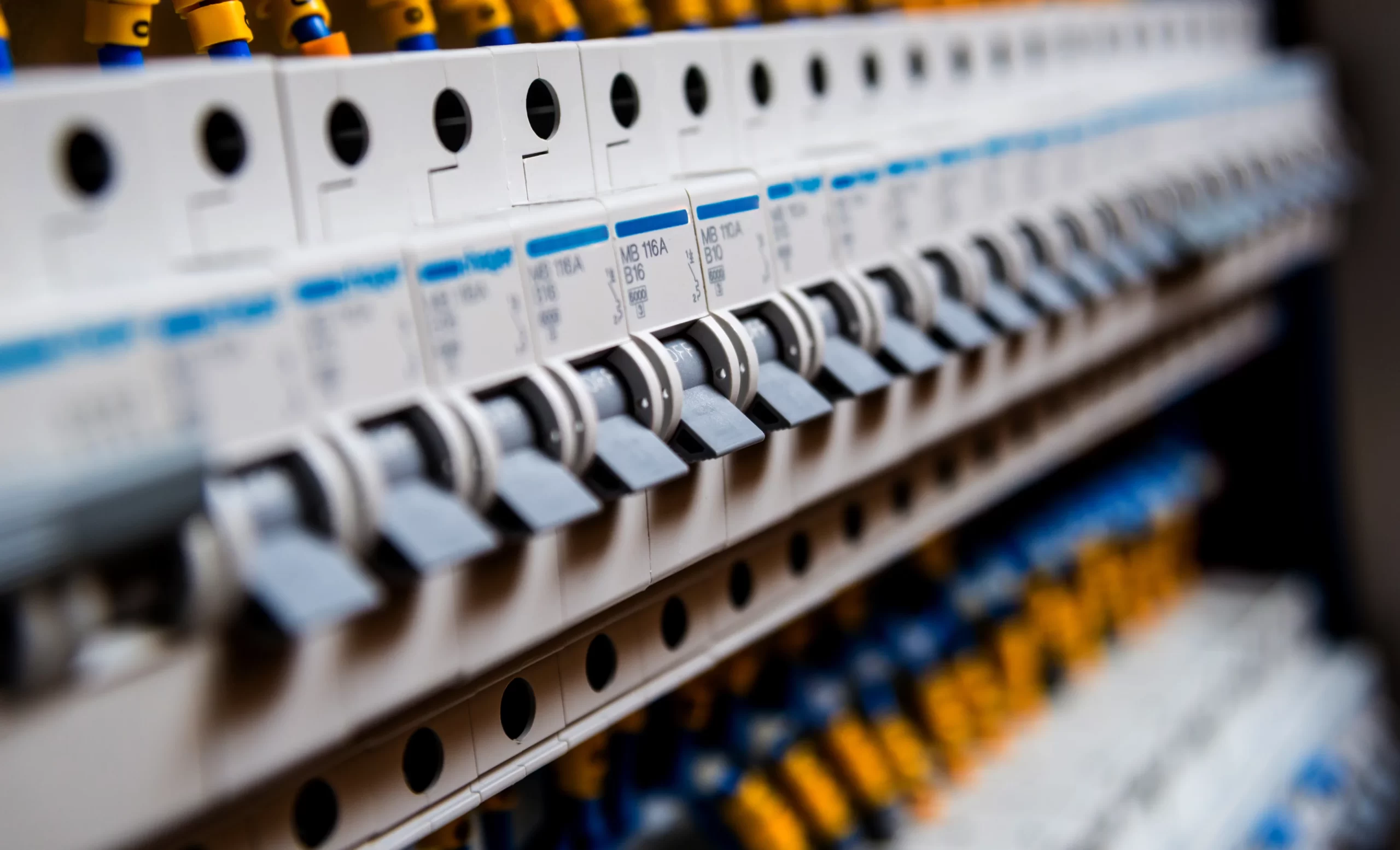 Switchboard installation by Electra Electrics, highlighting a modern electrical switchboard with neatly labeled circuit breakers and organized wiring, emphasizing safety and precision.