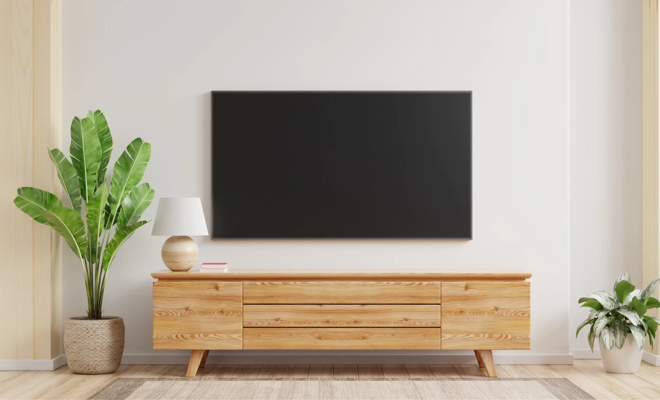TV installation by Electra Electrics, showing a flat-screen television mounted on a wall in a modern living room, with neatly organized cables and a clean, professional setup.